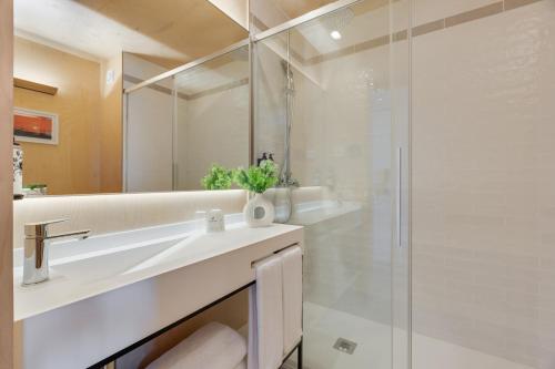 a bathroom with a sink and a shower at Pestana Dunas All Inclusive in Porto Santo