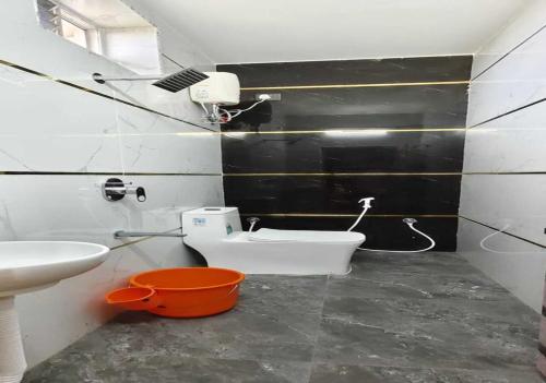 a bathroom with a sink and a toilet in it at S R RESORTS in Chīrāla
