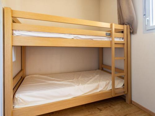 a couple of bunk beds in a room at Les Chalets d Ax N 303 - 2P4C in Ax-les-Thermes