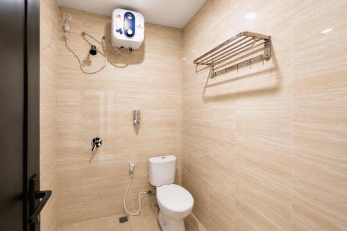a bathroom with a toilet and a shower stall at Samara Villa by Sinergi in Tawangmangu