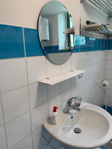 a bathroom with a sink and a mirror at Casa Mao in Noto