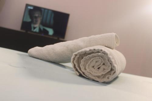 a roll of toilet paper sitting on top of a table at Astória - Hotel & Suites in Soyo
