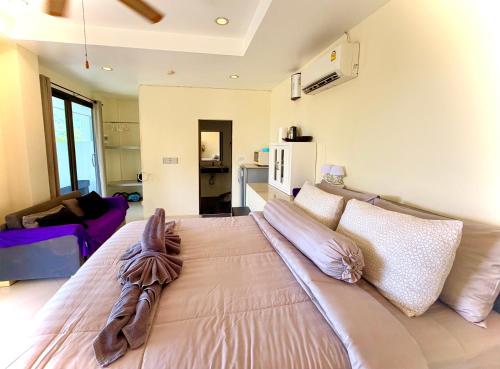 a bedroom with a large bed in a room at Viking House Apartment in Ko Tao
