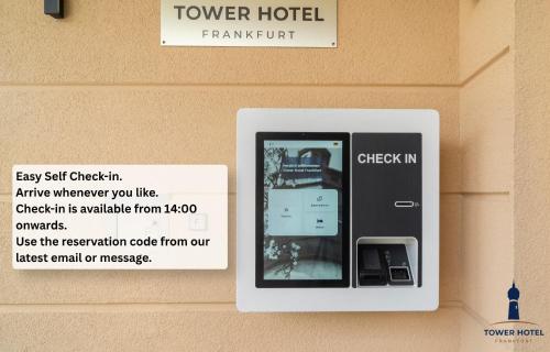 a sign for a drawer hotel with a phone in it at Tower Hotel Frankfurt in Frankfurt
