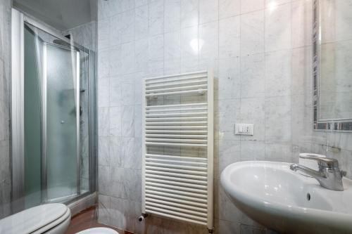 a bathroom with a sink and a toilet at Grand Hotel Panama Firenze in Florence