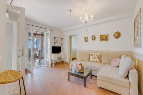 a living room with a couch and a table at Villa Aurora with Sea View in Seravezza