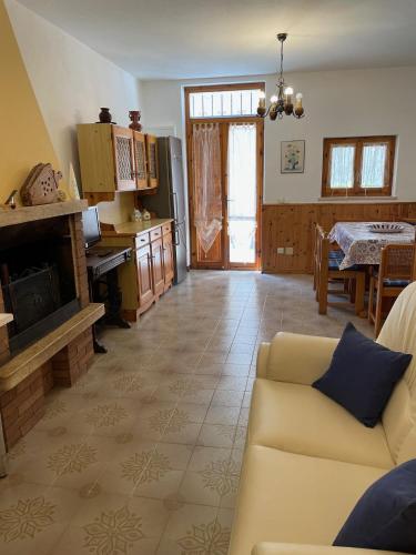 a living room with a couch and a fireplace at Casa Sandrina in Caprino Veronese