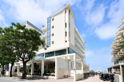 a white building on the side of a street at Hotel delle Nazioni in Pesaro