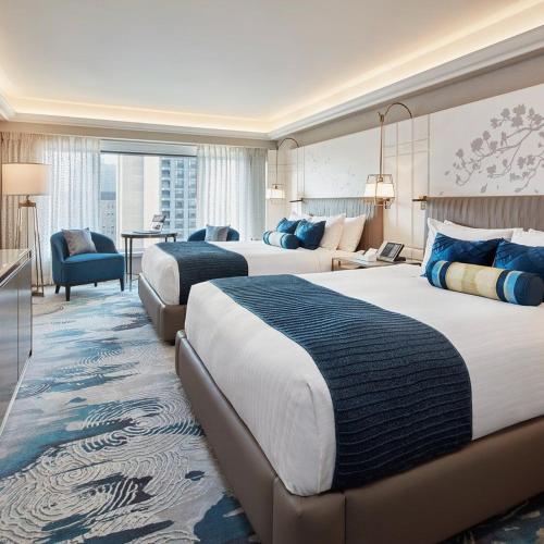 a hotel room with two beds and a living room at Mayott By Vilaastaa in Indore