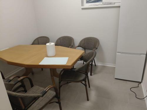 a conference room with a table and chairs and a refrigerator at Senera Minerals in Valea lui Mihai