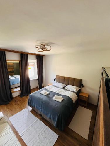 a bedroom with a bed and a ceiling at Villa GoldenPearl in Povile