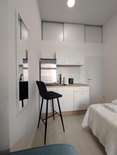 Small Studio With Detached Private Bathroom
