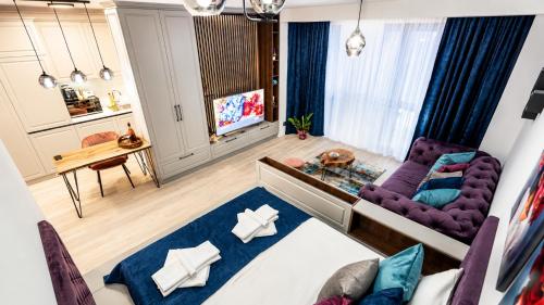 an overhead view of a living room with a purple couch at Briana Luxury Panoramic View in Cluj-Napoca