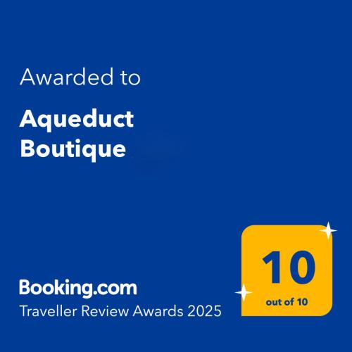 a yellow square with the words awarded to aotuctoitoulderoulderoulder at Aqueduct Boutique B&B in Victoria