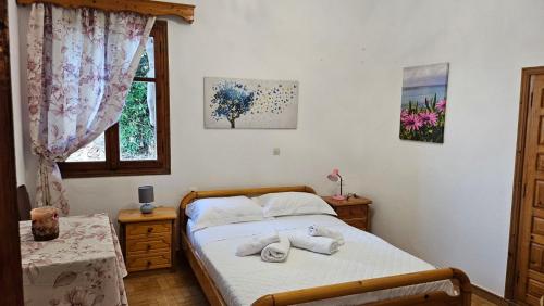 a bedroom with a bed with towels on it at Sea Breeze Retreat in Lionas