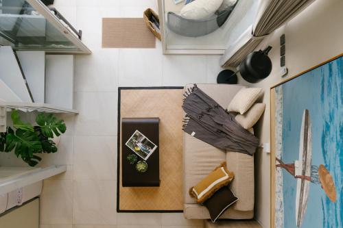 a room with a table and some plants and shelves at Villa Drift, Balangan 1BR Surf Getaway in Bingin Beach