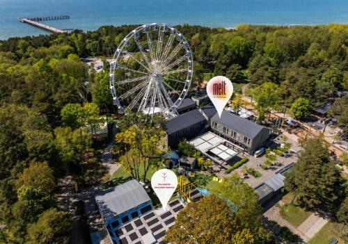 an aerial view of a ferris wheel and a building at Melt in Palanga Self check-in in Palanga