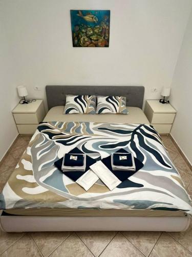 a bed in a bedroom with two night stands at Blue Coast Ivo in Piran