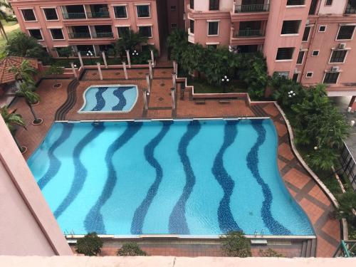 an overhead view of a swimming pool in a building at Zoomma Marina Court Condo in Kota Kinabalu