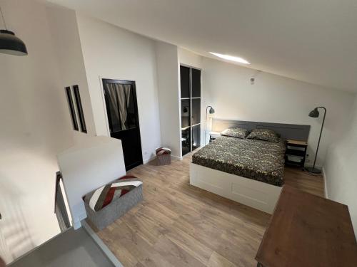 a bedroom with a bed and a table in it at Villecroze 1 in Villecroze