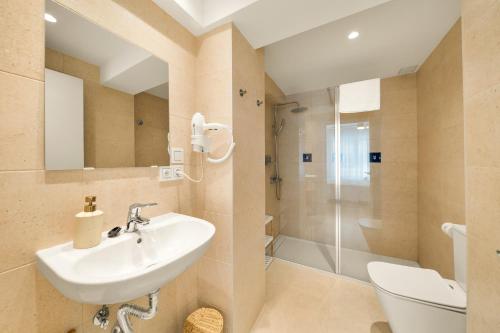 a bathroom with a sink and a shower at Jomarijo Boutique Rooms in Fuengirola