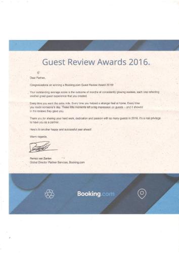 a screenshot of a guest review awards webpage at Grace Guest Home in Trichūr