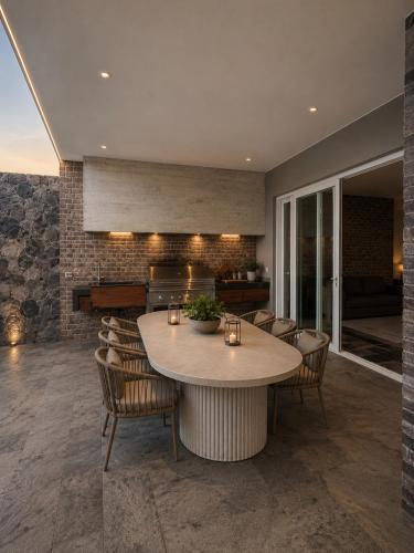a dining room with a table and chairs at Casa Catalina - Oceanfront house Lima in Lima