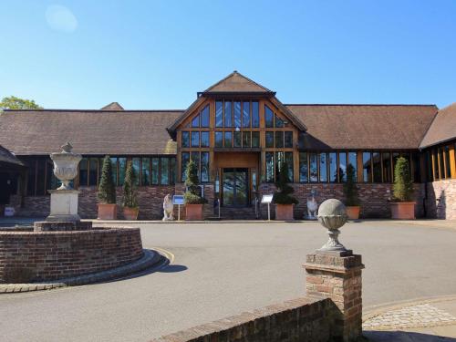 a large building with a large building with windows at Old Thorns Golf Resort And Spa Hampshire by Accor in Liphook