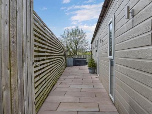 a hallway of a house with a wooden fence at The Lune - Uk47035 in Kirkby Lonsdale