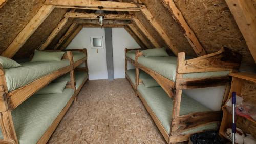 a room with two bunk beds in a attic at Pridvorica in Gacko