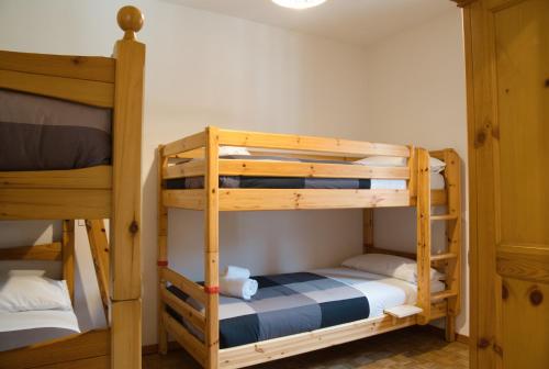 a bunk bed room with two bunk beds at Casa Rachele - mountain panorama in Cassina Valsassina