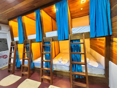 a group of four bunk beds in a room at Backpackers inn Hostel in Trincomalee