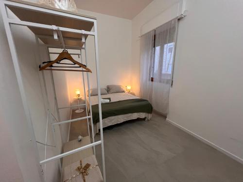 a bedroom with a bunk bed in a room at Alessandra guest house in Alghero