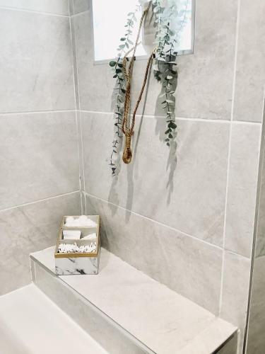 a bathroom with a box of tissues sitting on a sink at Derbyshire House Apartment 3 - Cavendish in Buxton