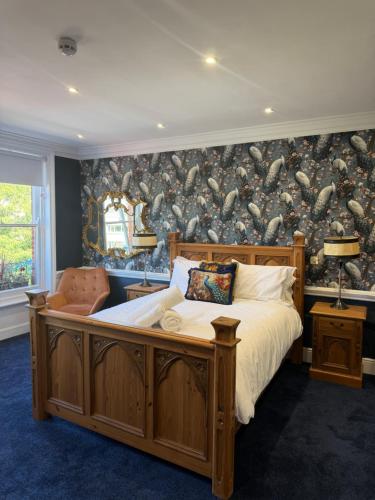 a bedroom with a large bed and a wall of shoes at Kip 54 Monks Bar in Portsmouth