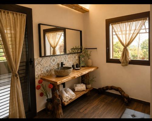 a bathroom with a sink and a mirror at Etna Country Home in Nicolosi
