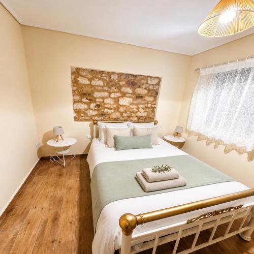 a bedroom with a large bed in a room at Olive Coast House 3 100m from the sea in Kyparissia