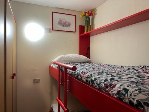 a bedroom with a bunk bed in a room at Cervinia Mountain View Apartments in Breuil-Cervinia