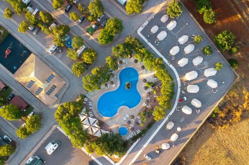 an aerial view of a parking lot with a pool at Kampaoh Tavira in Tavira