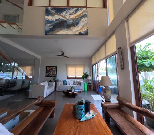 a living room with benches and a table at The Reef Anilao in Mabini
