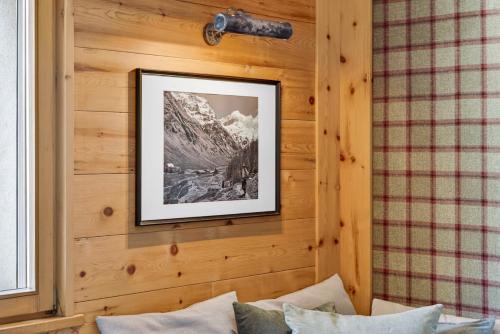 a picture hanging on a wall in a room at Alpine Studio Flat near Sankt Moritz in Celerina