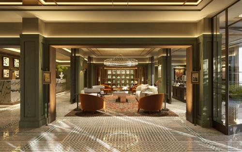 a lobby of a hotel with a chandelier at The St. Regis London in London