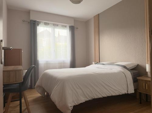 a bedroom with a white bed and a window at La Maison du Bocage in Saint-Mesmin
