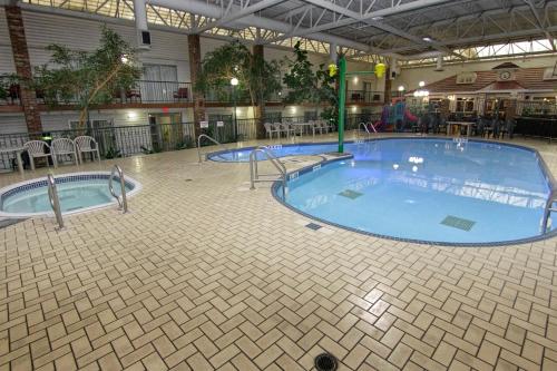 a large swimming pool in a building at Victoria Inn Hotel & Convention Centre Brandon in Brandon