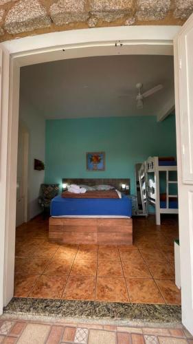 a bedroom with a bed in the middle of a room at Pousada Casa do Rio - 8 min do Centro Hístorico in Paraty