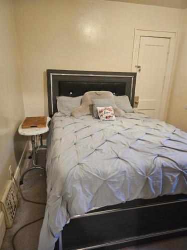 a bedroom with a large bed with a night stand at Plantlife LLC A in Minneapolis