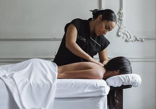 a woman sitting on top of a bed with at Boga Mexico City by Lumina in Mexico City