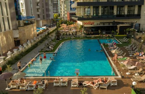 an overhead view of a swimming pool in a city at Green Side Apart Hotel Official in Batumi