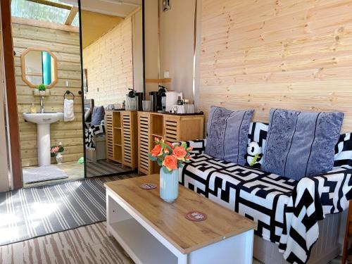 a living room with a couch and a table at The Cabin in the Woods in Dublin