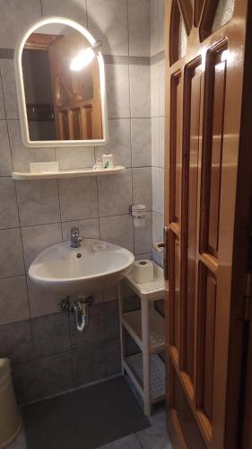 a bathroom with a sink and a mirror at Vasiliki Bay in Vasiliki